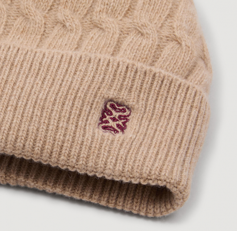 Женская бежевая шерстяная шапка
