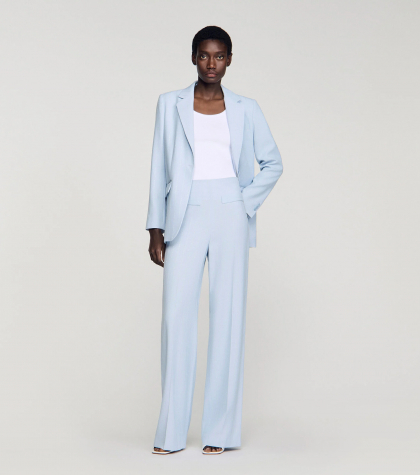 Жіночі брюки у вертикальну смужку з паєтками