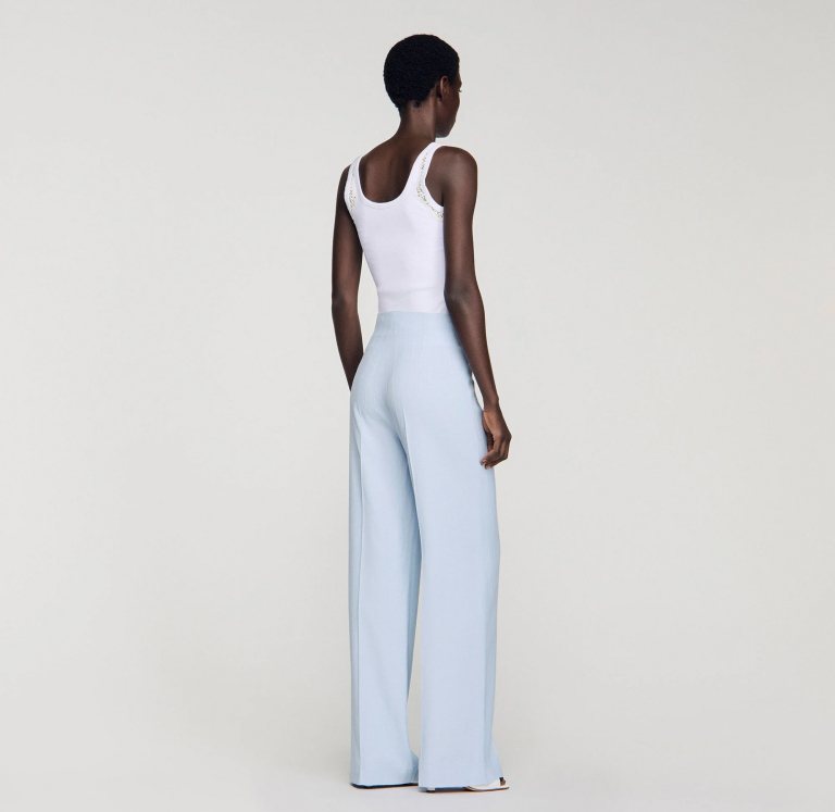 Женские брюки в вертикальную полоску с пайетками