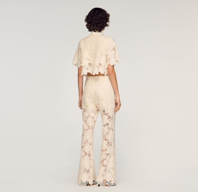 Жіночі молочні гіпюрові брюки