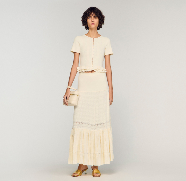 Жіноча молочна в'язана спідниця