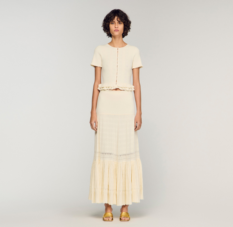 Жіноча молочна в'язана спідниця