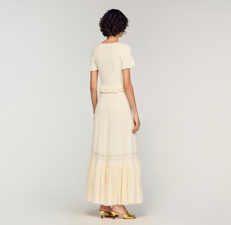 Жіноча молочна в'язана спідниця