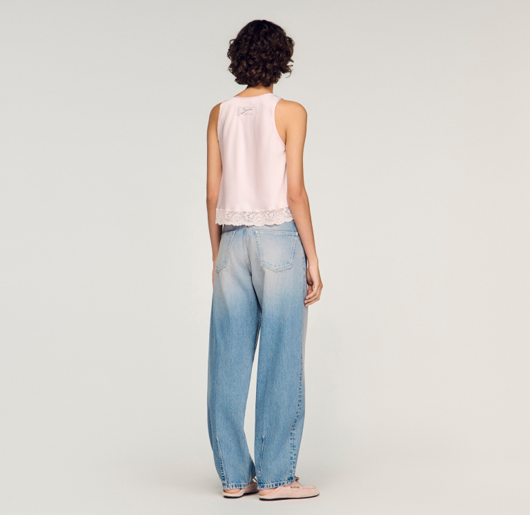 Женские джинсы-баллоны с эффектом потертости