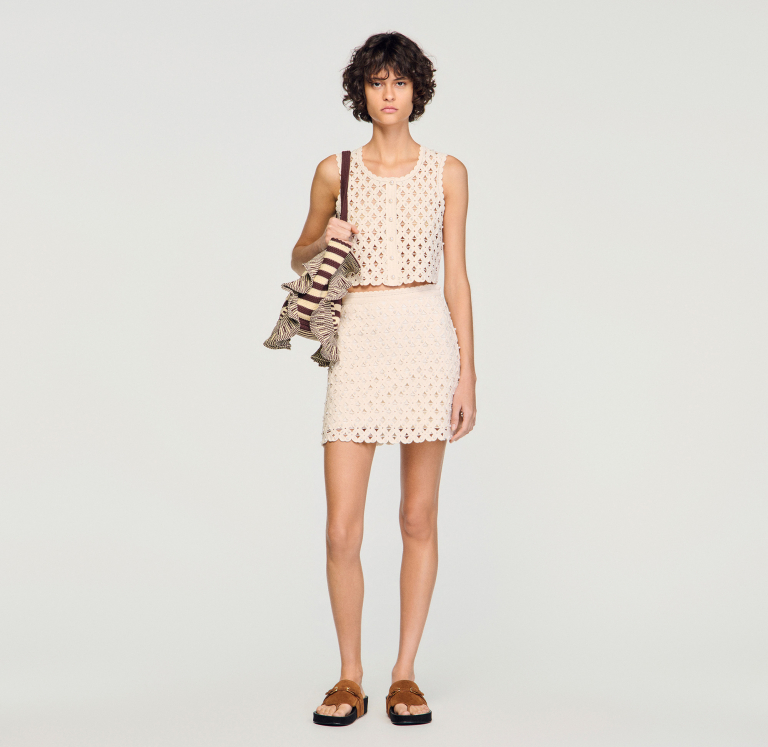 Жіноча молочна в'язана спідниця з бісером