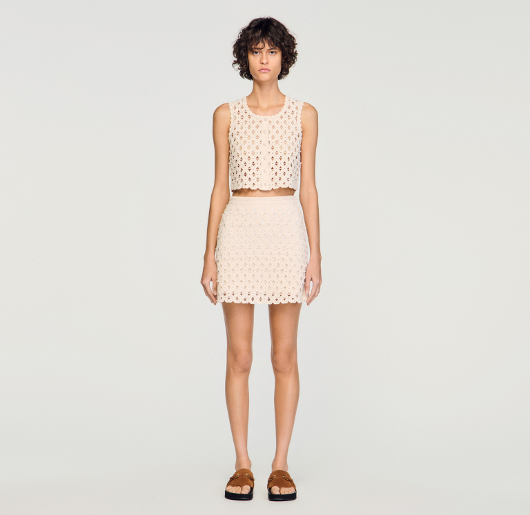 Жіноча молочна в'язана спідниця з бісером